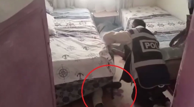 Polis, aranan şahsı saklandığı yatağından altında buldu